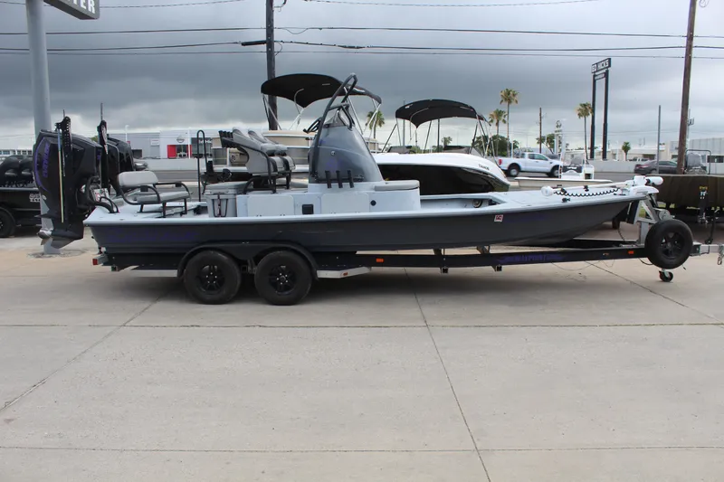 The Image of 2019 Shoalwater 23 Catamaran on trailer, parked outdoors under cloudy sky. - 1