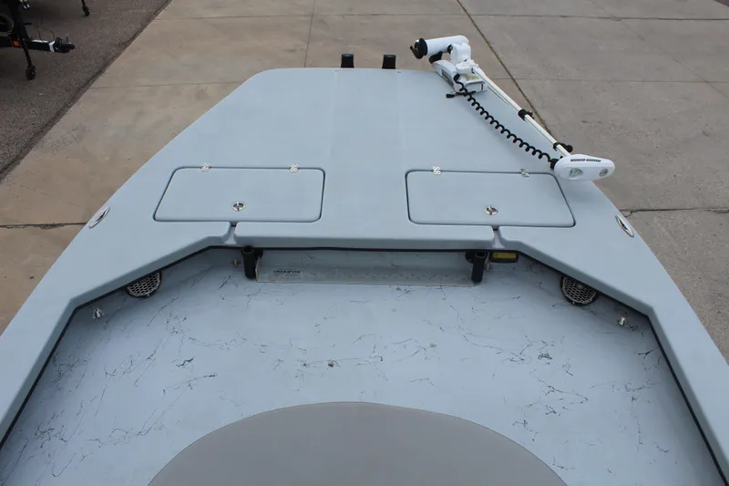 Slide: The Image of 2019 Shoalwater 23 Catamaran deck with storage hatches and trolling motor. - 11