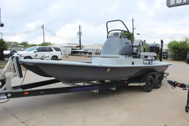 Slide: The Image of 2019 Shoalwater 23 Catamaran on trailer, parked outdoors, overcast sky. - 4