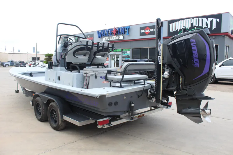 Slide: The Image of 2019 Shoalwater 23 Catamaran with Evinrude engine on trailer at dealership. - 7
