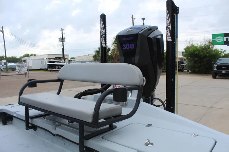 Slide: The Image of 2019 Shoalwater 23 Catamaran with Evinrude 300 engine and seating, parked outdoors. - 9