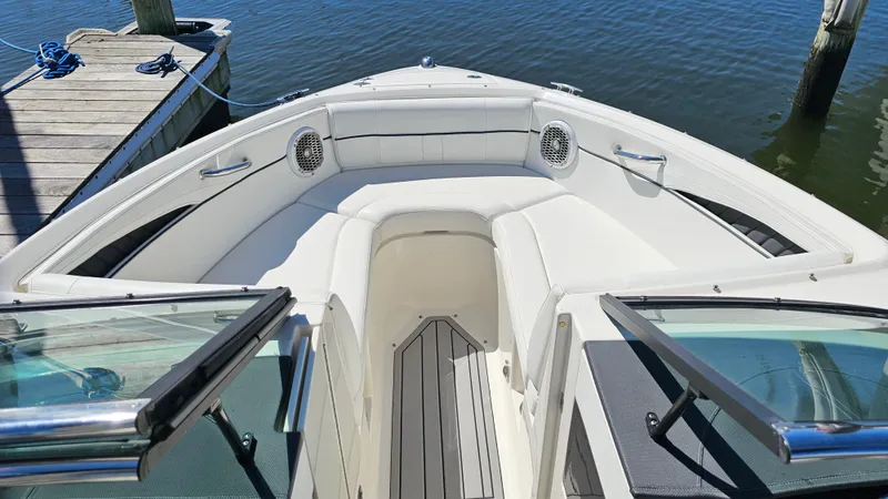 Slide: The Image of 2016 Sea Ray 230 SLX boat interior with white seating and open deck view. - 21