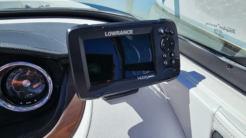 Slide: The Image of Lowrance Hook GPS system on 2016 Sea Ray 230 SLX boat dashboard. - 28