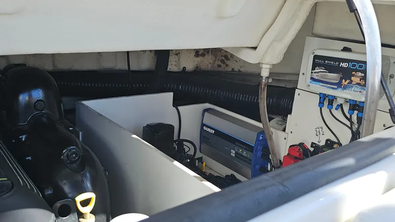 Slide: The Image of Engine compartment of a 2016 Sea Ray 230 SLX boat, showcasing mechanical components. - 37