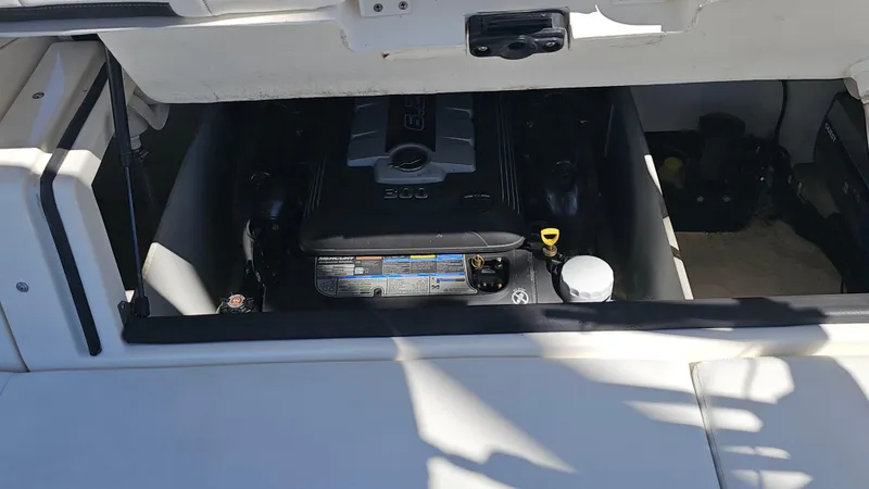 Slide: The Image of Engine compartment of a 2016 Sea Ray 230 SLX boat, showcasing the engine details. - 41