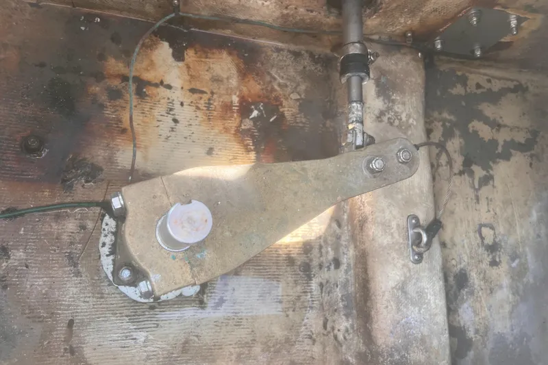 Slide: The Image of Steering mechanism of a 1986 Cape Dory 28 Pilot House boat, showing metal components. - 40