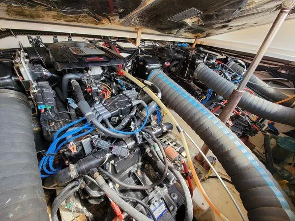 Slide: The Image of 1995 Tiara Yachts 3100 Open engine compartment with 2017 FWC engines, showcasing detailed mechanics. - 17