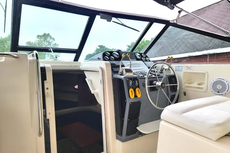 Slide: The Image of 1995 Tiara Yachts 3100 Open helm with modern controls and comfortable seating. - 18