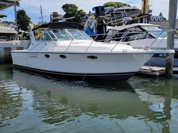 Slide: The Image of Tiara Yachts 3100 Open, 1995 model, docked in marina, featuring 2017 FWC engines. - 24