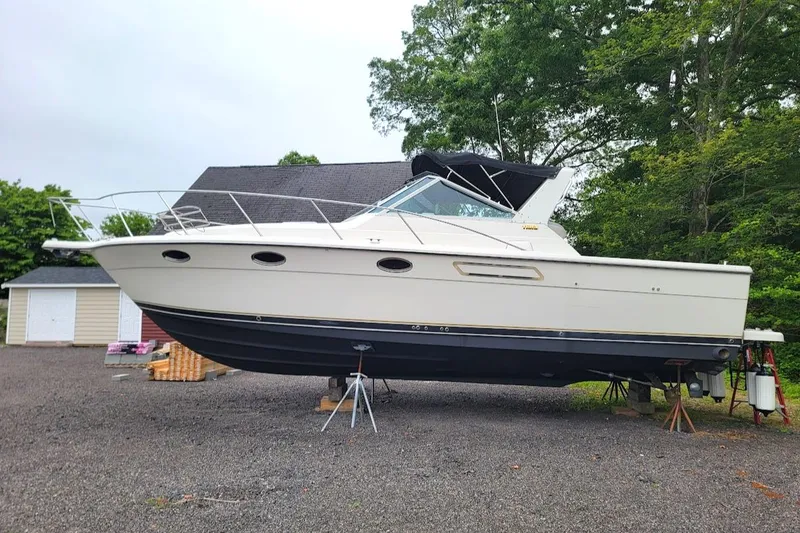 Slide: The Image of 1995 Tiara Yachts 3100 Open on stands, featuring 2017 FWC engines, outdoors. - 28