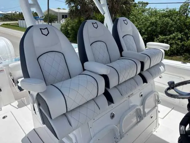 Slide: The Image of Luxurious seating on 2025 Sea Fox 328 Commander boat with quilted design and armrests. - 12