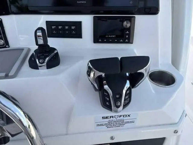 Slide: The Image of Control panel of 2025 Sea Fox 328 Commander boat with advanced navigation equipment. - 14