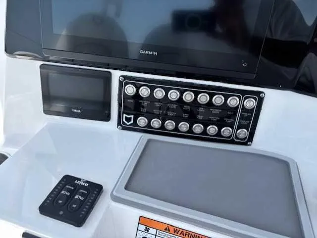 Slide: The Image of Control panel of 2025 Sea Fox 328 Commander boat with Garmin display. - 15