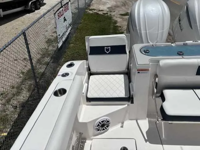 Slide: The Image of 2025 Sea Fox 328 Commander boat interior with seating and cup holders. - 19