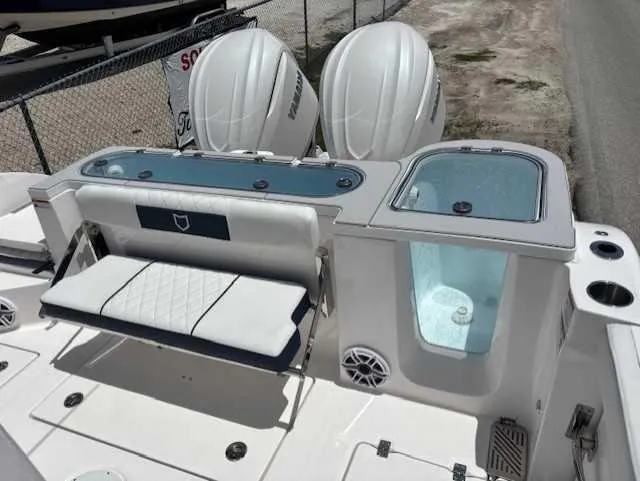 Slide: The Image of 2025 Sea Fox 328 Commander boat with dual engines and seating area. - 22