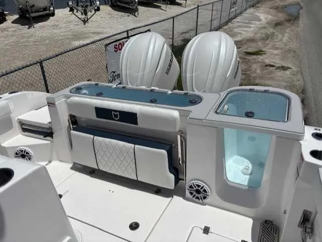 Slide: The Image of 2025 Sea Fox 328 Commander boat with dual engines and spacious deck layout. - 24