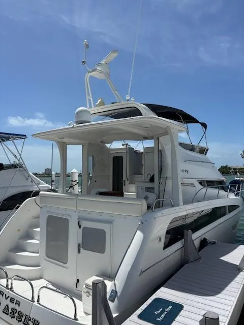 The Image of 2006 Carver 43 Motor Yacht docked under clear blue sky. - 1
