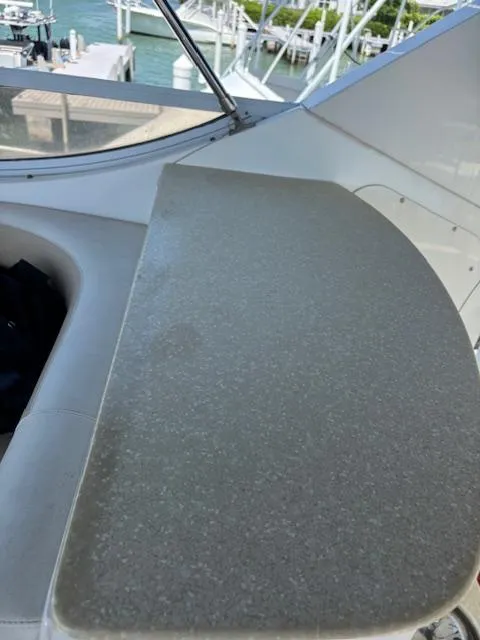 Slide: The Image of 2006 Carver 43 Motor Yacht interior detail with a sleek countertop and marina view. - 14