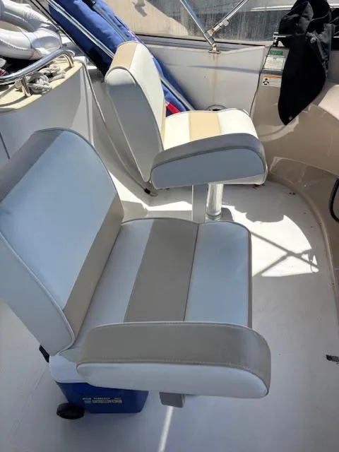 Slide: The Image of Captain's chairs on 2006 Carver 43 Motor Yacht, featuring beige and white upholstery. - 16