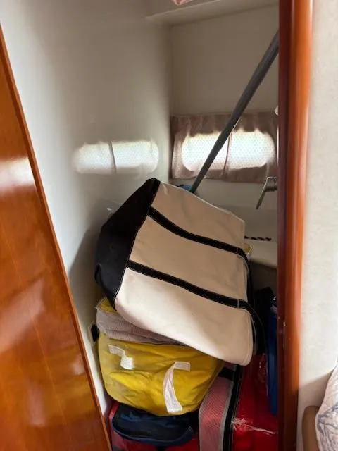 Slide: The Image of Storage area inside 2006 Carver 43 Motor Yacht with bags and equipment. - 39