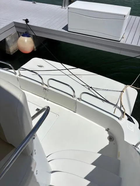 Slide: The Image of 2006 Carver 43 Motor Yacht docked, showing deck and railing details. - 19