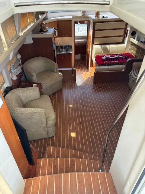 Slide: The Image of Interior of 2006 Carver 43 Motor Yacht with wood flooring and comfortable seating. - 25