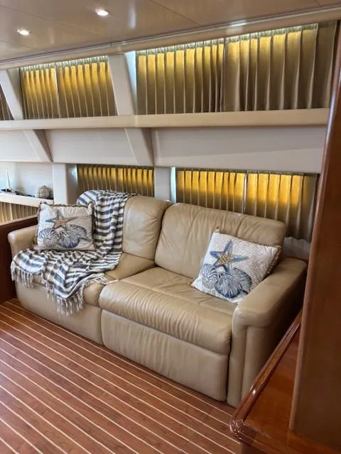 Slide: The Image of Luxurious interior of 2006 Carver 43 Motor Yacht with leather sofa and decorative pillows. - 27
