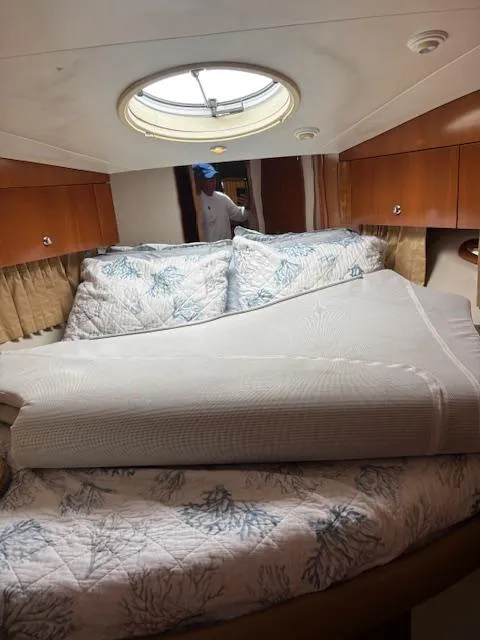Slide: The Image of Interior of 2006 Carver 43 Motor Yacht with cozy bed and porthole window. - 35