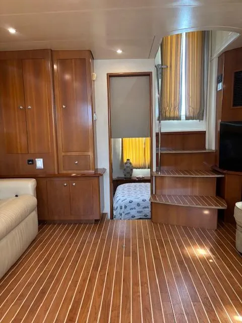 Slide: The Image of Interior of 2006 Carver 43 Motor Yacht with wooden flooring and cozy furnishings. - 40