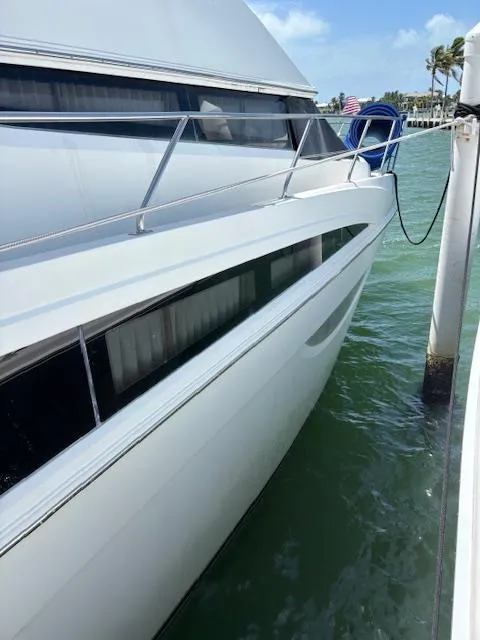 Slide: The Image of 2006 Carver 43 Motor Yacht docked in sunny marina, side view. - 7