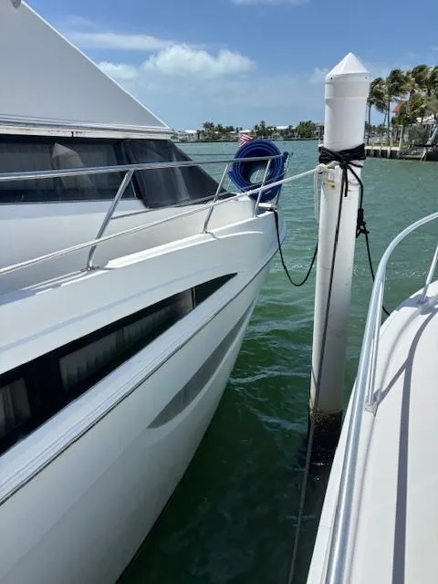Slide: The Image of 2006 Carver 43 Motor Yacht docked, sunny day, calm waters, blue sky. - 8
