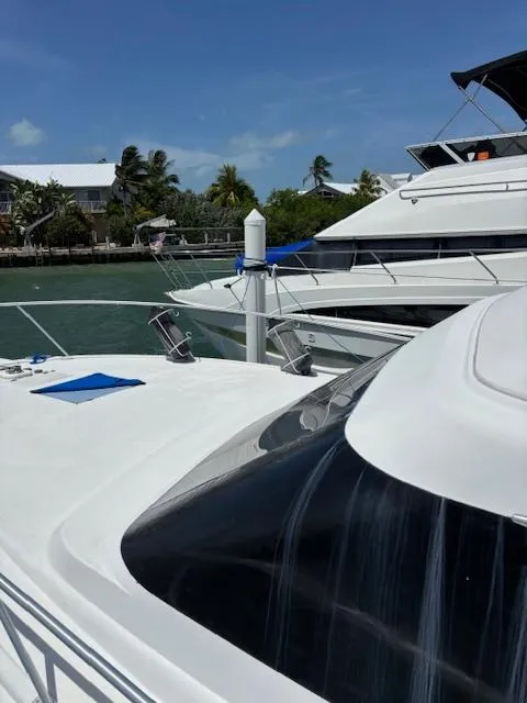 Slide: The Image of 2006 Carver 43 Motor Yacht docked in sunny marina with palm trees. - 9