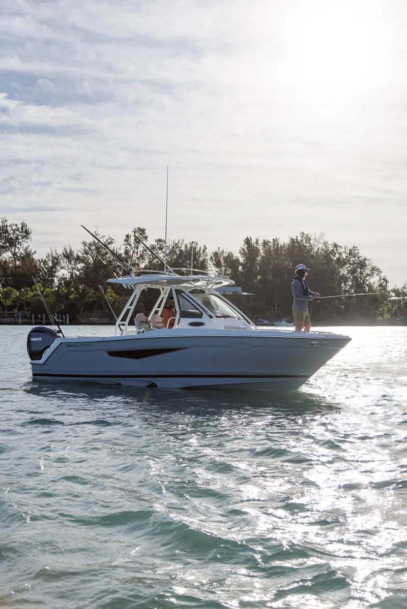 Slide: The Image of 2026 Solara S-250 CW boat on water with person fishing, sunny day. - 3