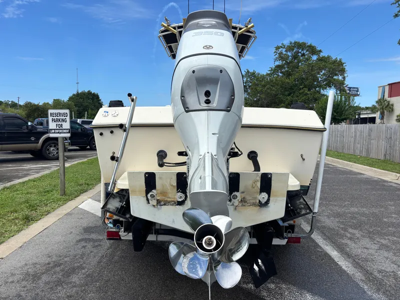 Slide: The Image of Rear view of a 2003 KenCraft 235 Challenger boat with an outboard motor. - 12