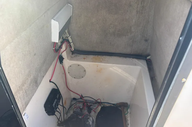 Slide: The Image of Interior view of a 2003 KenCraft 235 Challenger boat compartment with wiring. - 15