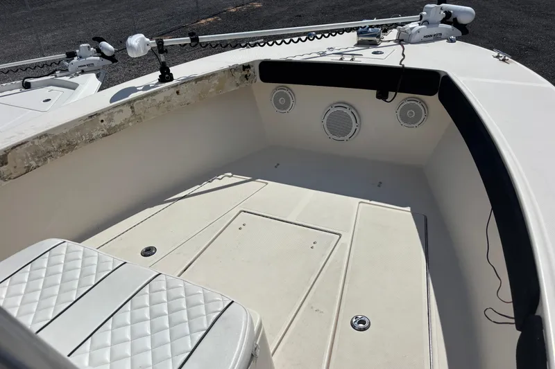 Slide: The Image of 2003 KenCraft 235 Challenger boat interior with seating and speakers. - 18