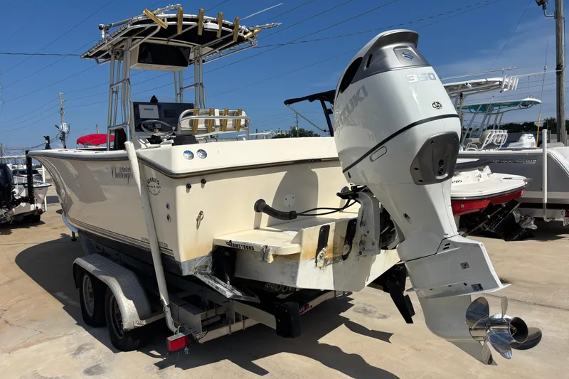 Slide: The Image of 2003 KenCraft 235 Challenger boat with Suzuki 350 outboard motor on trailer. - 2