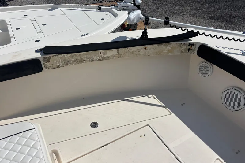 Slide: The Image of 2003 KenCraft 235 Challenger boat interior with speakers and storage compartments. - 24
