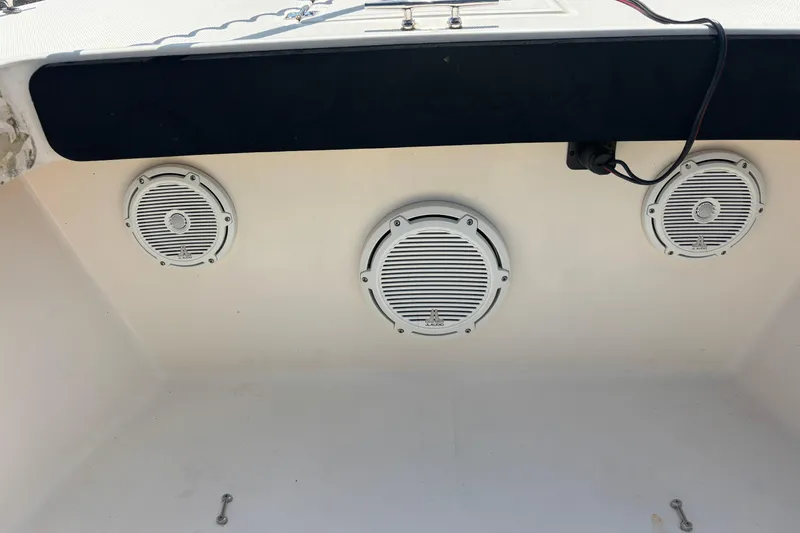 Slide: The Image of Speakers installed on a 2003 KenCraft 235 Challenger boat interior. - 25