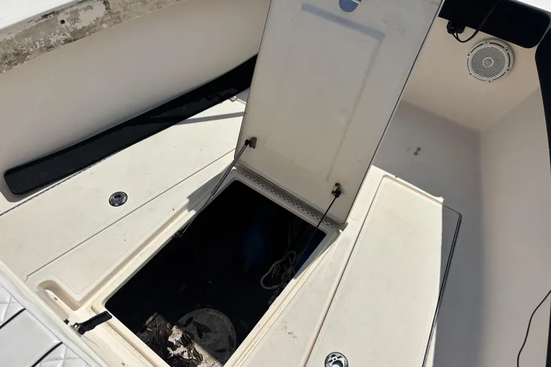 Slide: The Image of Open storage compartment on 2003 KenCraft 235 Challenger boat deck. - 31