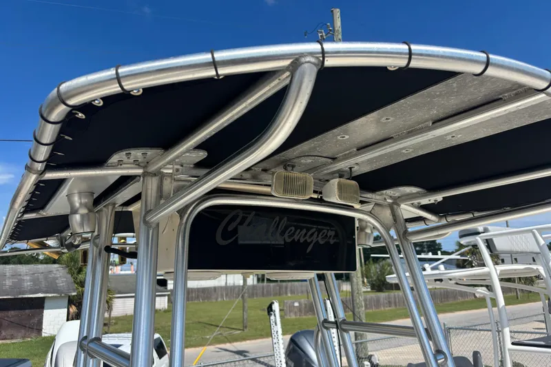 Slide: The Image of 2003 KenCraft 235 Challenger boat T-top with sturdy metal frame and mounted lights. - 37