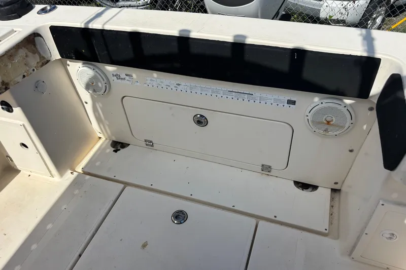 Slide: The Image of 2003 KenCraft 235 Challenger boat interior with storage compartment and speakers. - 38