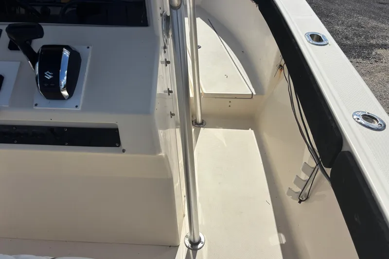 Slide: The Image of 2003 KenCraft 235 Challenger boat interior with control panel and railing. - 40