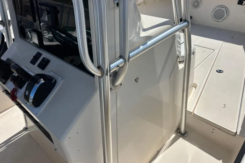 Slide: The Image of 2003 KenCraft 235 Challenger boat console with steering and controls. - 41