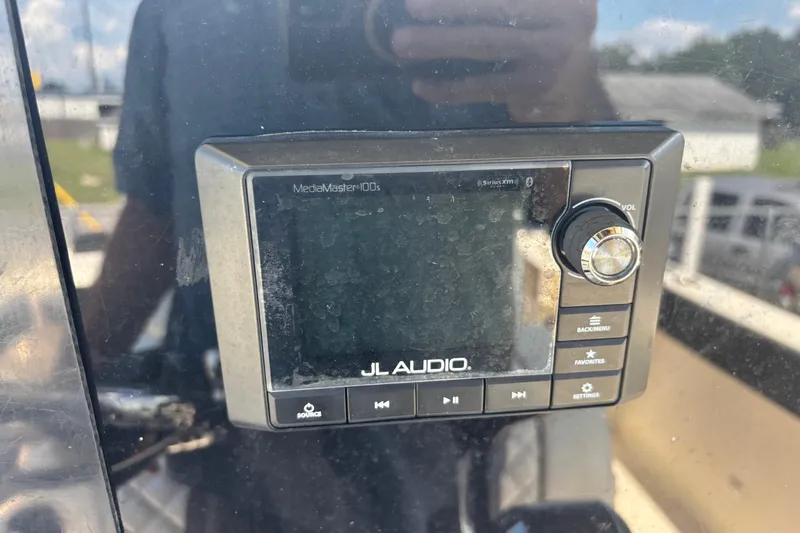 Slide: The Image of JL Audio MediaMaster 100s on 2003 KenCraft 235 Challenger boat dashboard. - 43