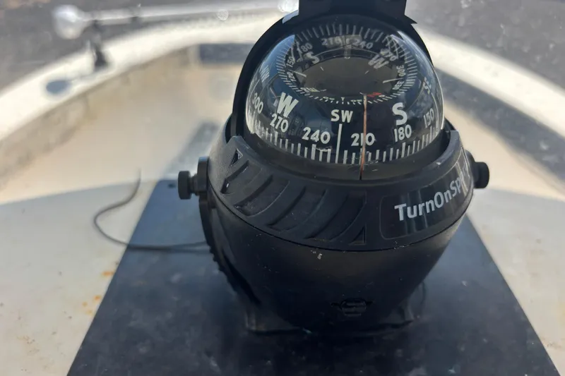 Slide: The Image of Compass on 2003 KenCraft 235 Challenger boat, showing southwest direction. - 45