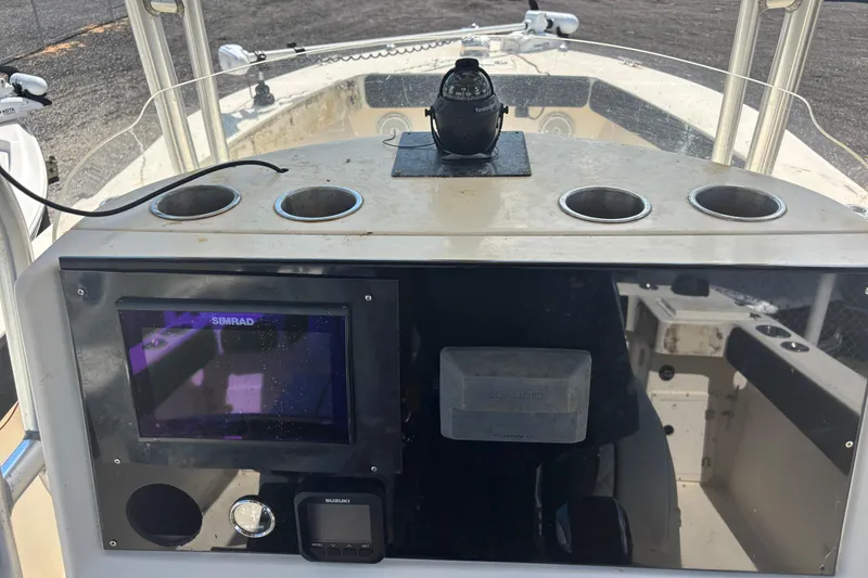 Slide: The Image of 2003 KenCraft 235 Challenger boat dashboard with Simrad display and compass. - 46
