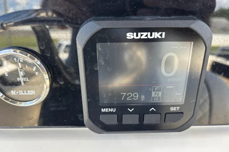 Slide: The Image of Suzuki digital display and Moeller fuel gauge on 2003 KenCraft 235 Challenger boat. - 49