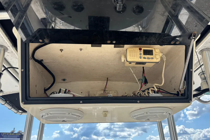 Slide: The Image of 2003 KenCraft 235 Challenger boat electronics compartment with radio and wiring. - 50