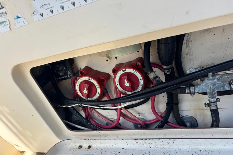 Slide: The Image of Electrical panel of 2003 KenCraft 235 Challenger boat with red switches and wiring. - 51